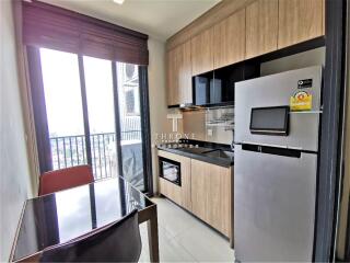 Modern kitchen with dining area and natural light