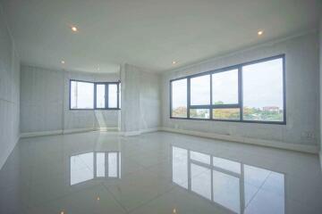 Spacious living room with large windows