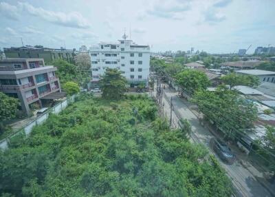 Vacant land with surrounding buildings