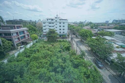 Vacant land with surrounding buildings