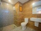 Modern bathroom with wood effect tiles and walk-in shower