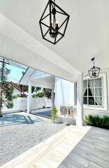 Covered outdoor space with modern lighting fixtures