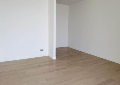 Spacious empty room with wooden flooring