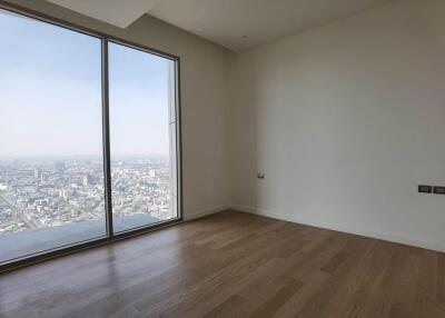 Bedroom with large window and city view