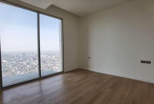 Bedroom with large window and city view