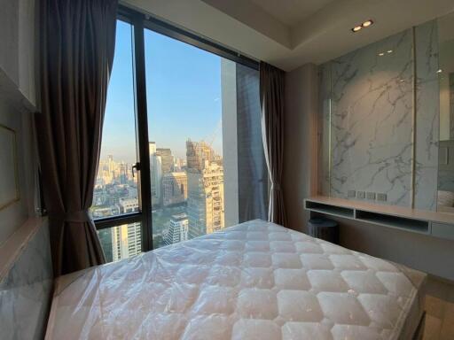 High-rise bedroom with a city view