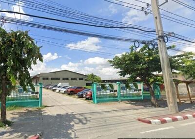 Entrance to commercial building with parked cars