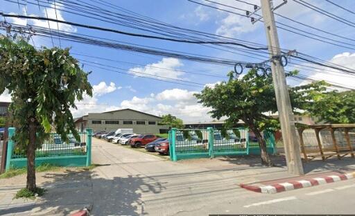 Entrance to commercial building with parked cars