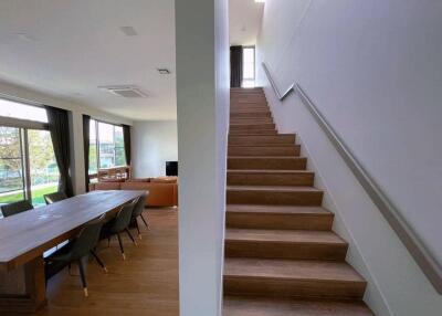 Modern living space with dining area and staircase