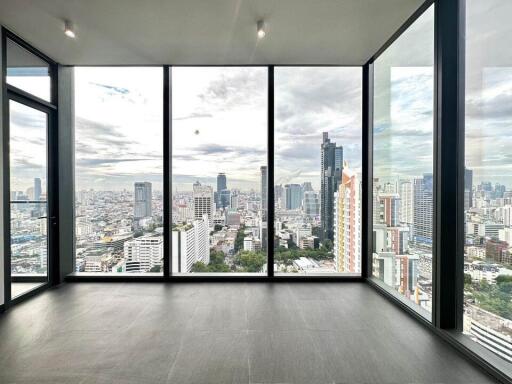 Living room with large windows and city view