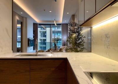 Modern kitchen with a view into the living area