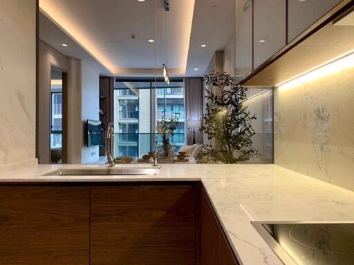 Modern kitchen with a view into the living area