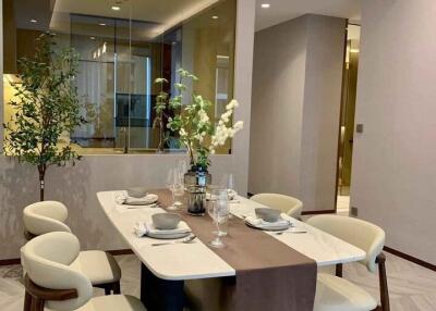 Modern dining area with a contemporary table setup and stylish chairs