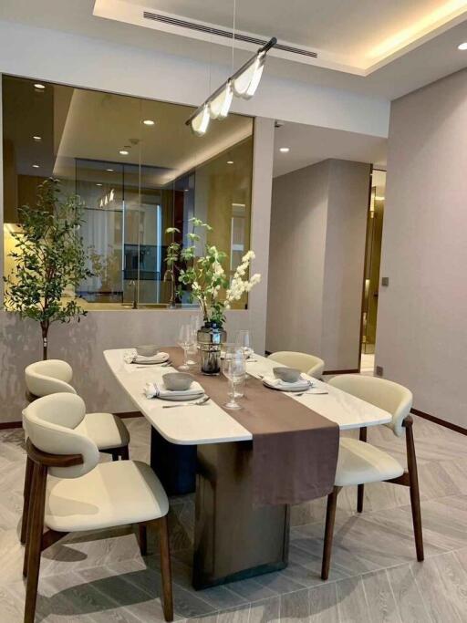 Modern dining area with a contemporary table setup and stylish chairs