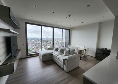 Modern living room with large windows and city view