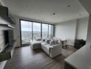 Modern living room with large windows and city view