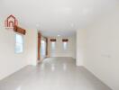 Spacious empty living room with large windows and recessed lighting