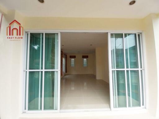 Main living space with sliding glass doors and recessed lighting