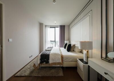 Modern bedroom with large window and stylish decor