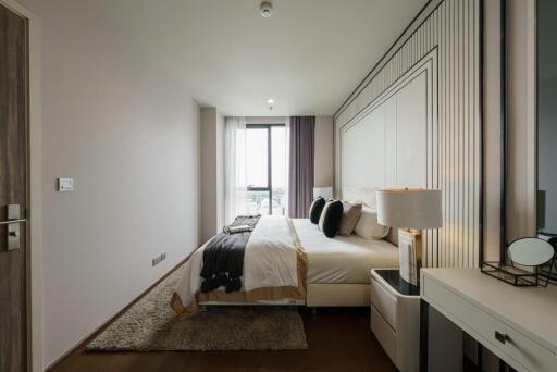 Modern bedroom with large window and stylish decor