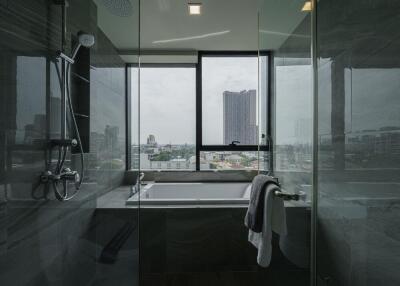 Modern bathroom with bathtub and city view