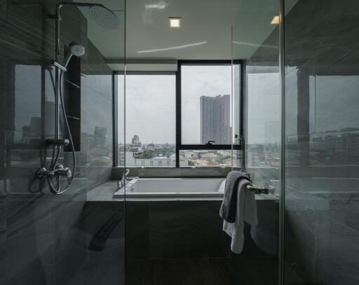 Modern bathroom with bathtub and city view