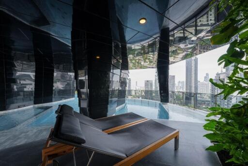 Indoor pool area with city view