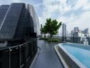 Modern building rooftop with a pool and city view