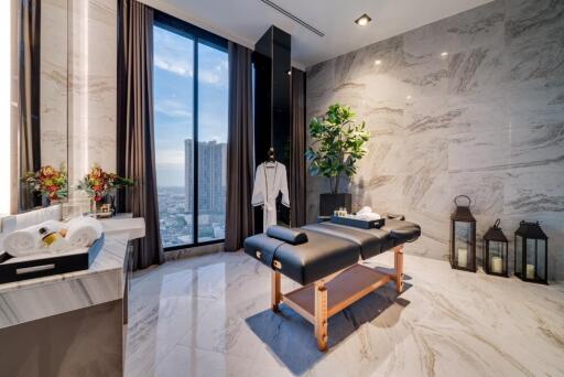 Luxury spa room with marble decor and city view