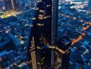 Aerial view of a modern high-rise building at dusk