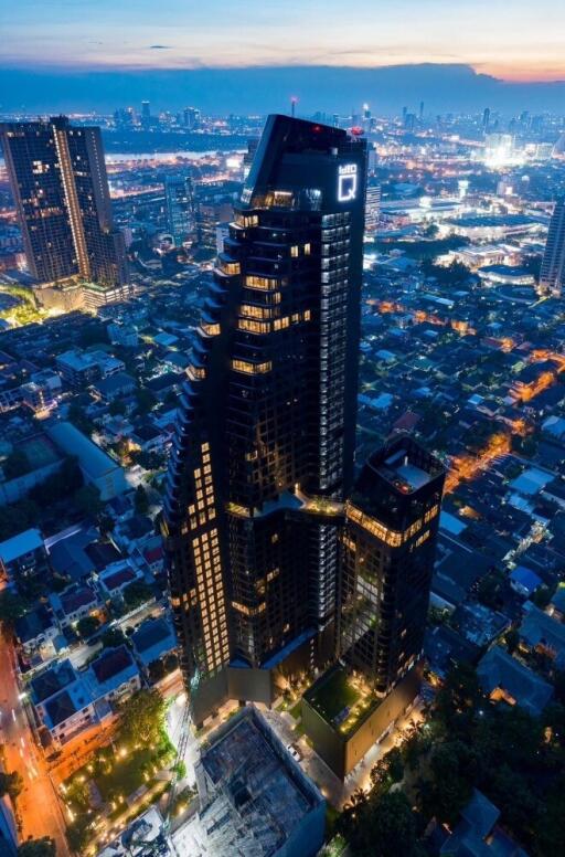 Aerial view of a modern high-rise building at dusk