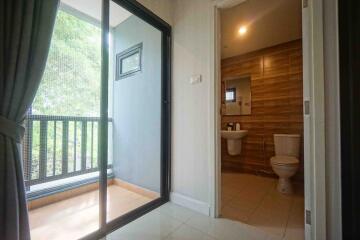 View of a bathroom and a patio doorway