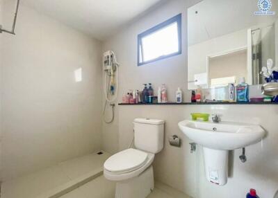 Modern bathroom with shower, sink, and toilet