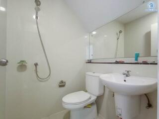 Modern bathroom with shower, toilet, and sink