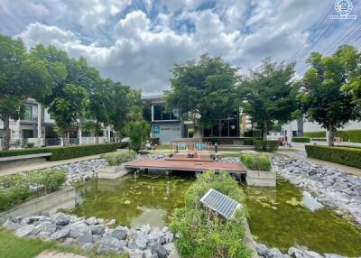 Community area with pond and greenery