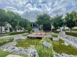 Community area with pond and greenery