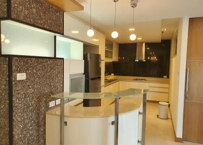 Modern kitchen with mosaic tiles and floating lights