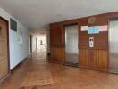 Apartment building hallway with elevators