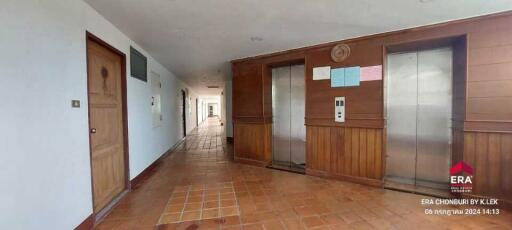 Apartment building hallway with elevators