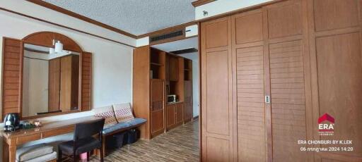 Spacious bedroom with wooden furniture