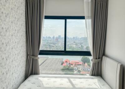 Bedroom with a view of the city