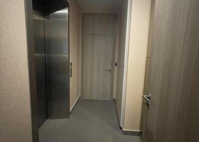 Hallway with elevator and door