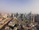 Aerial view of a city skyline with numerous skyscrapers and buildings