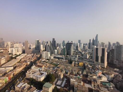 Aerial view of a city skyline with numerous skyscrapers and buildings