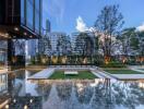 Exterior view of modern building with outdoor landscaping and water feature