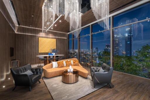 Modern living room with city view and elegant chandelier