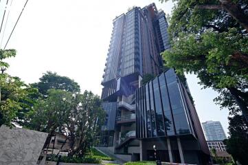 Modern high-rise residential building with glass facade