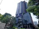 Modern high-rise residential building with glass facade