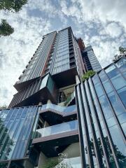 Modern high-rise apartment building with glass facades and balconies