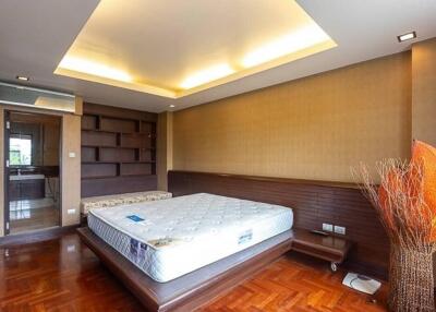 Master bedroom with modern design and wooden flooring
